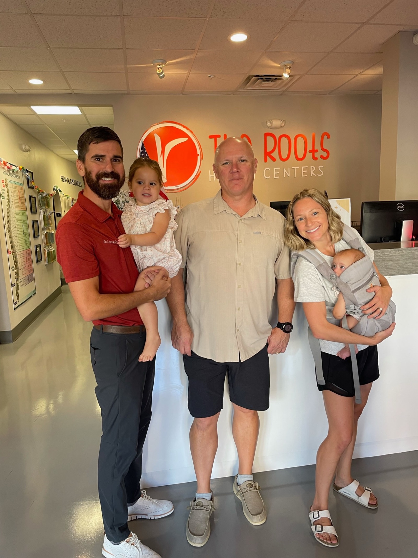 Dr. Laura and Dr. Logan with a longtime patient family at the clinic.